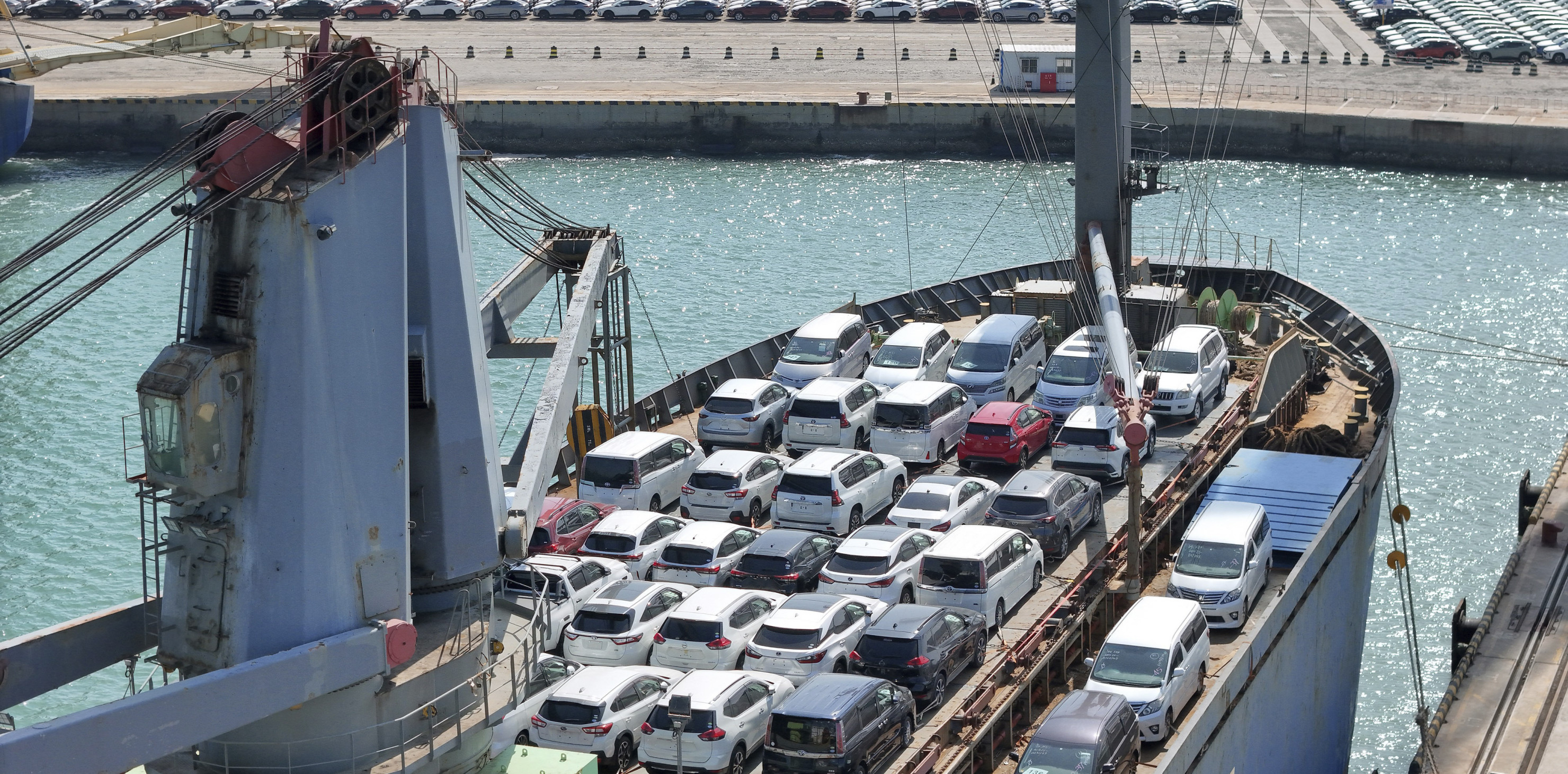 A ship is loaded with vehicles for export in a port in Yantai in east China's Shandong province.