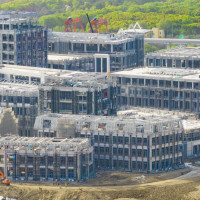 Builders, along with hundreds of engineering vehicles and ladders, push forward the construction of key projects at Huawei's Qingpu R&D Center in Shanghai, China, April 12, 2023.