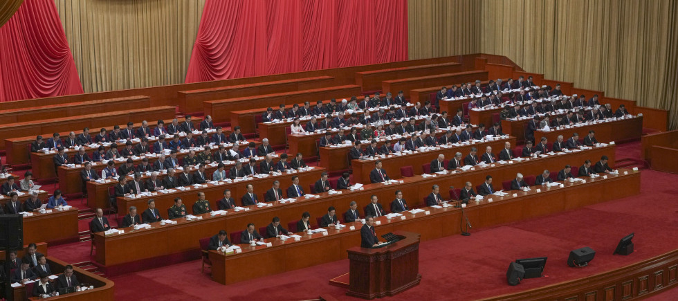 Chinese Premier Li Qiang speaks from a lectern during the opening session of the National People's Congress (NPC) at the Great Hall of the People in Beijing, China, Wednesday, March 5, 2025. 